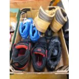 A tray containing four pairs of shoes