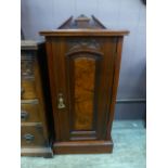 An Edwardian walnut pot cupboard having