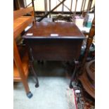 An early 20th century mahogany sewing bo