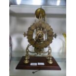 A 19th century brass skeleton clock on a