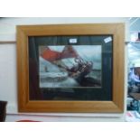 A framed and glazed photographic print o