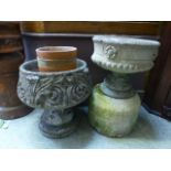 Two composite stone garden urns along wi