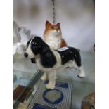 A ceramic model of a Spaniel together wi