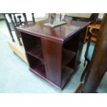 A reproduction mahogany revolving bookca