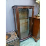 A reproduction mahogany display cabinet