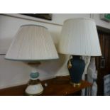 A cream and green table lamp along with
