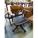 An early 20th century oak office chair