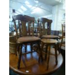 Three wooden chairs along with a pine st