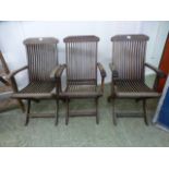 A set of three teak folding garden chair