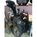 Two golf bags with an assortment of golf