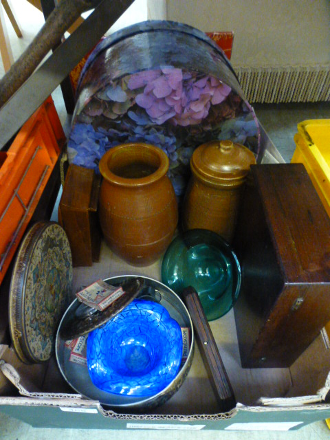 A tray containing vases, plaques, storag