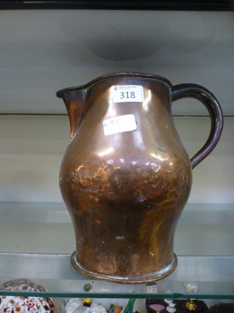 A 19th century copper water jug