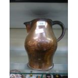 A 19th century copper water jug