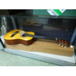 A small Vulcan acoustic guitar