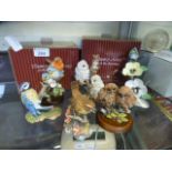 A collection of ceramic bird ornaments t