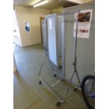 A chromed metal clothes rail on castors