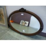 An early 20th century oak framed oval be