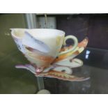 A Franz cup and saucer in the form of bu