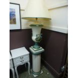 A modern cream and green painted lamp on