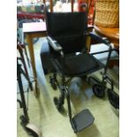 A black tubular wheel chair