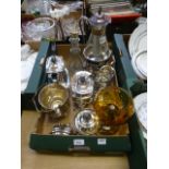 A tray containing a plated tea set, ice