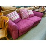 A cerise cut fabric substantial settee