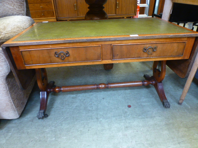 A reproduction yew low level sofa table