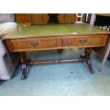 A reproduction yew low level sofa table