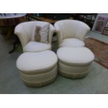 A pair of tub chairs with matching foot