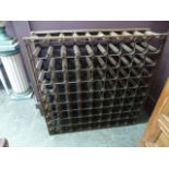 A metal and wooden wine rack