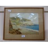 A framed and glazed watercolour of coast