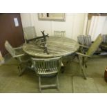 A weathered teak garden table along with