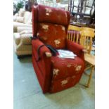 A red upholstered electric rise and recl