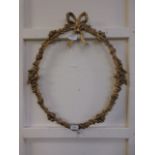 A ribbon design, gilt painted metal pict