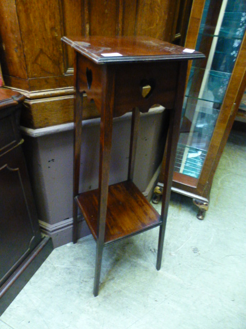 An early 20th century mahogany jardinier