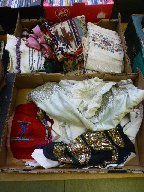 Two trays of eastern fabrics