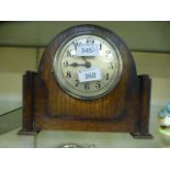 An oak cased mantle clock