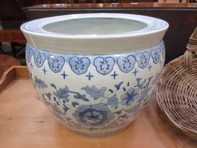 A blue and white Chinese style fish bowl