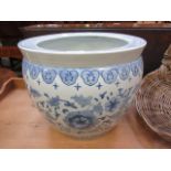 A blue and white Chinese style fish bowl