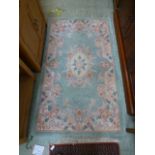 A green ground Chinese rug