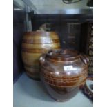 Two glazed storage jars, one with lid