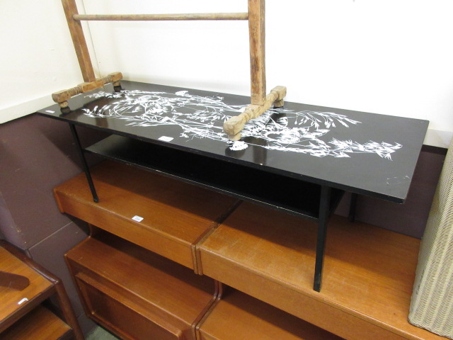 A 1960s black and white painted table on