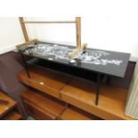 A 1960s black and white painted table on