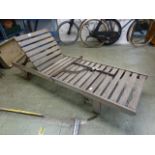 A teak lounger by Lister Teak