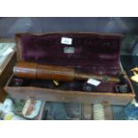 A cased leather covered telescope/micros