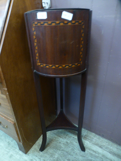 An Edwardian mahogany and inlaid jardini