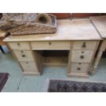 A waxed pine twin pedestal desk