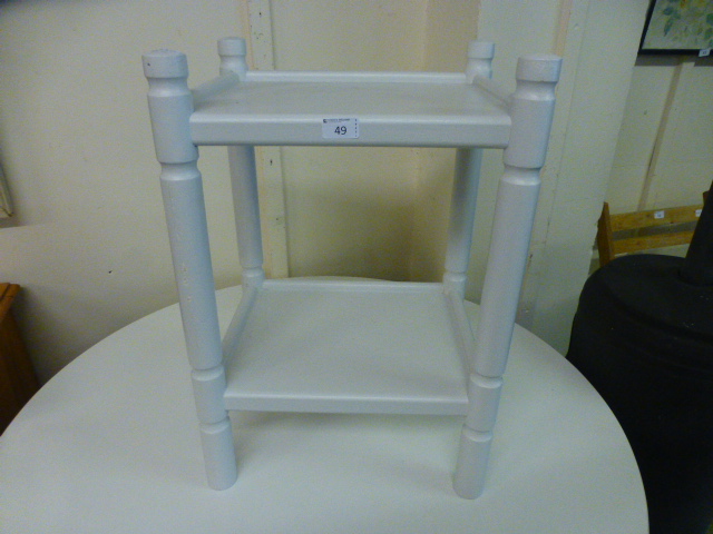 A white painted two tier stand