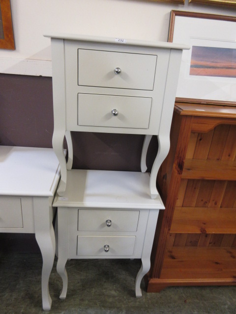 A pair of modern cream painted bedside c