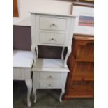 A pair of modern cream painted bedside c